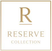 A gold letter "R" above the words "RESERVE COLLECTION" inside a square border, all on a black background.