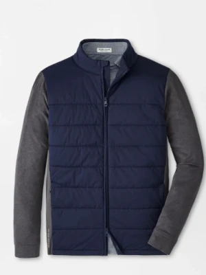 The image shows a navy quilted jacket with long grey sleeves and a zip closure on a white background.