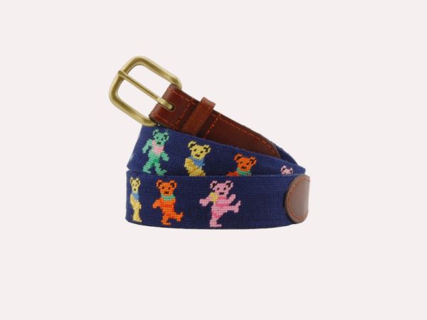 A blue belt with colorful dancing bear designs and a brass buckle.