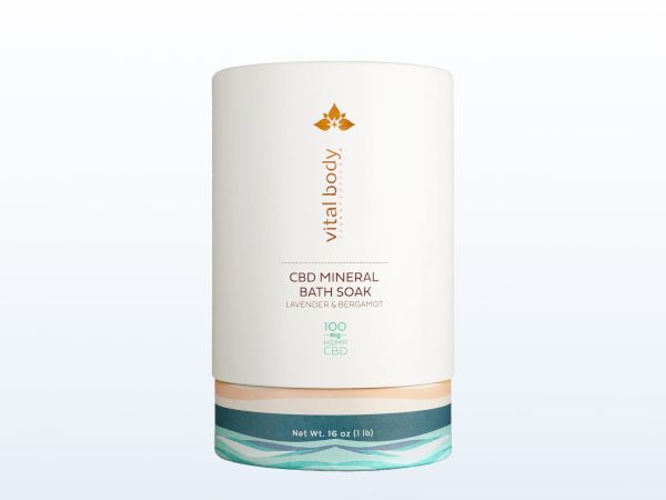 The image shows a container of Vital Body CBD Mineral Bath Soak with a clean, minimalist design ending the sentence.