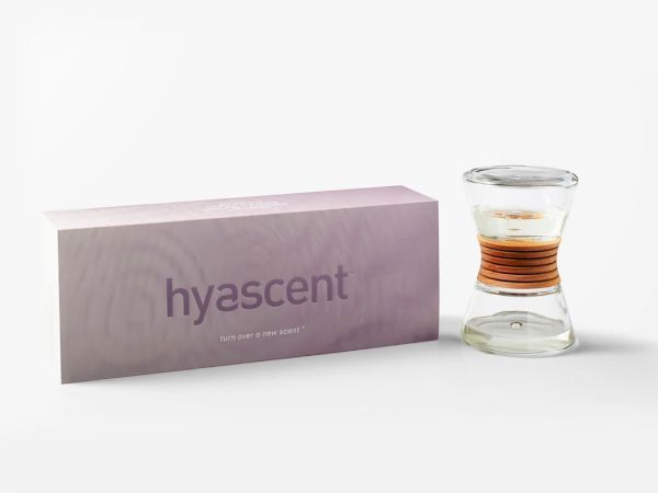 The image shows a Hyascent scented oil diffuser with a sleek glass design and packaging.